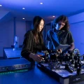 Quantum optics engineers using reconfigurable instrumentation in a laser lab